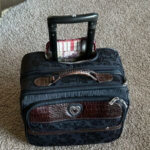 Brighton 15 by 12 by 9 inches depth rolling suitcase
 Clear zipper enclosure